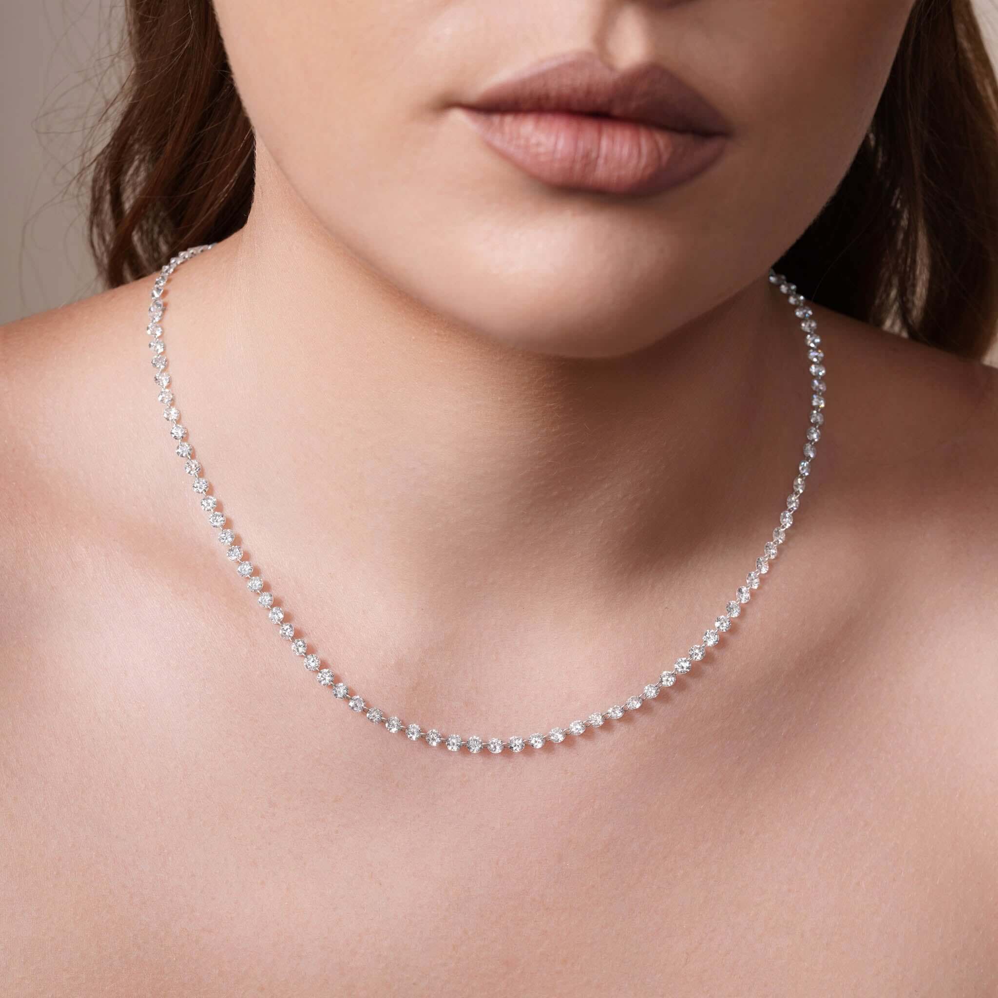 15 Carat Floating Lab Diamond Necklace worn by a model, showcasing its elegant sparkle and modern design.
