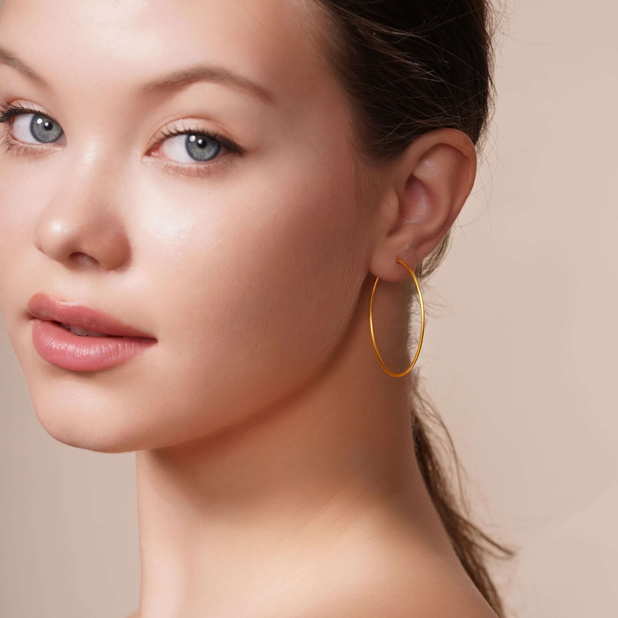 Model showcasing Gold Endless Hoop Earrings for timeless elegance and everyday style.