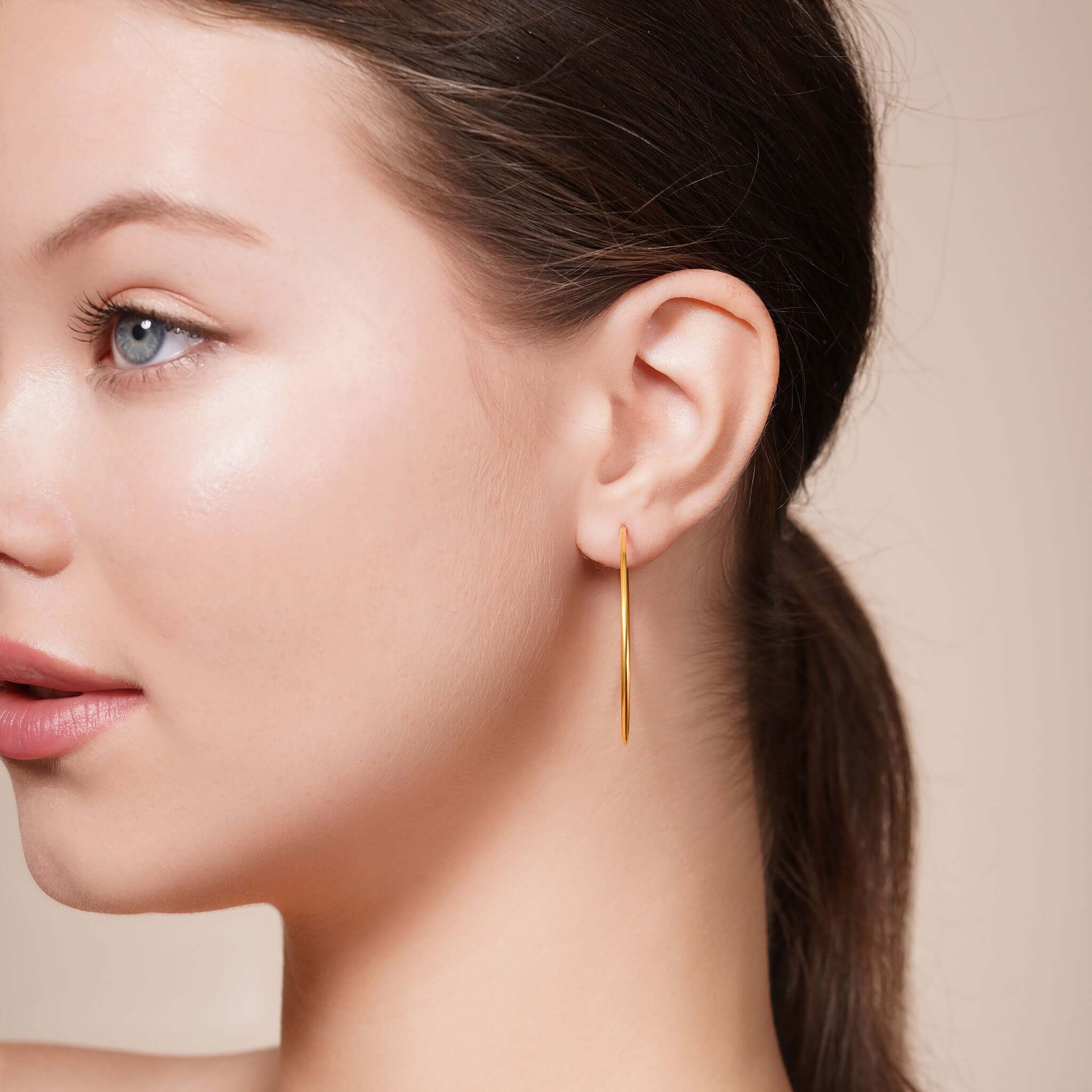 Gold Endless Hoop Earrings showcased on a model, highlighting their elegant design and beautiful shine.