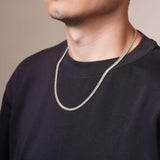 Men's White Gold Miami Cuban Chain worn on a model, showcasing its unique thick and rounded links.