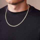 Men's White Gold Miami Cuban Chain worn by a man, showcasing its bold design and high-quality 14k solid white gold craftsmanship.