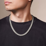 Men's White Gold Miami Cuban Chain worn by model, showcasing its bold and stylish design with interlocking links.