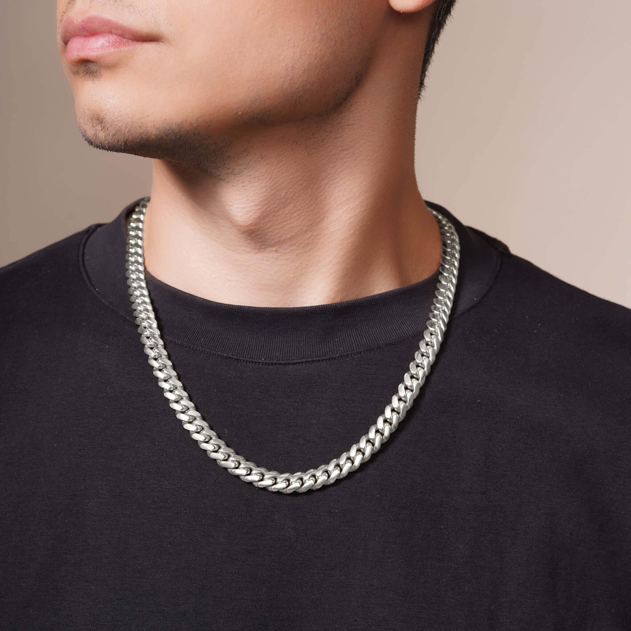 Men's White Gold Miami Cuban Chain worn by model, showcasing its bold and stylish design with interlocking links.