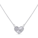 Engraved Heart Necklace in white gold featuring a textured heart-shaped pendant with a beaded border.