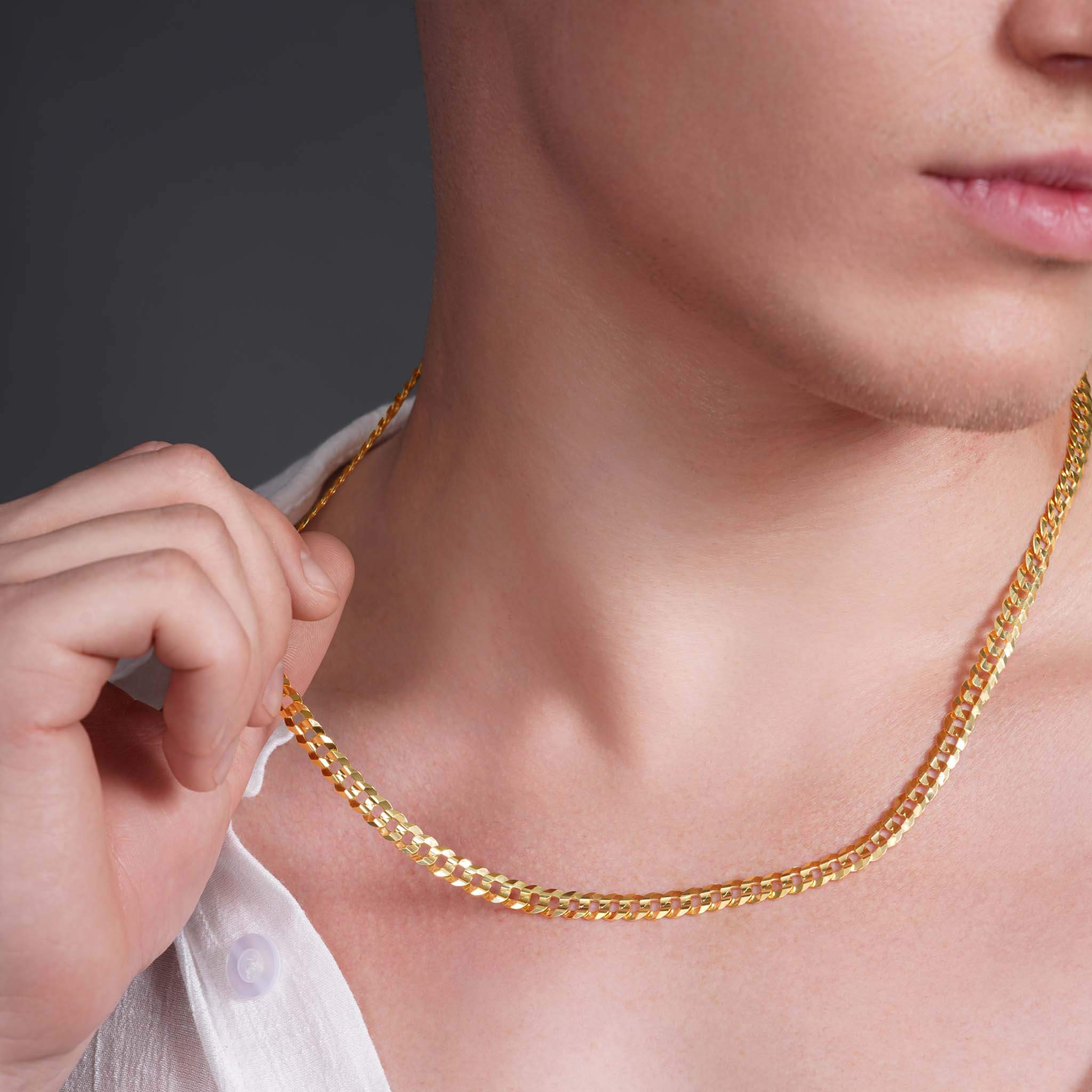 Close-up of a man wearing a Men’s Solid Gold Curb Chain, showcasing the bold design in 14k solid gold.