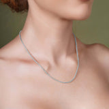 Woman wearing a Diamond Cut Franco Chain in silver, showcasing its elegant and sparkling design.