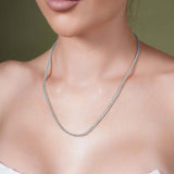 Model wearing a Diamond Cut Franco Chain in solid white gold, showcasing its sparkling facets and elegant design.