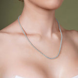 Diamond Cut Franco Chain worn as a sparkling accessory on a model's neckline, showcasing its 14k gold craftsmanship.