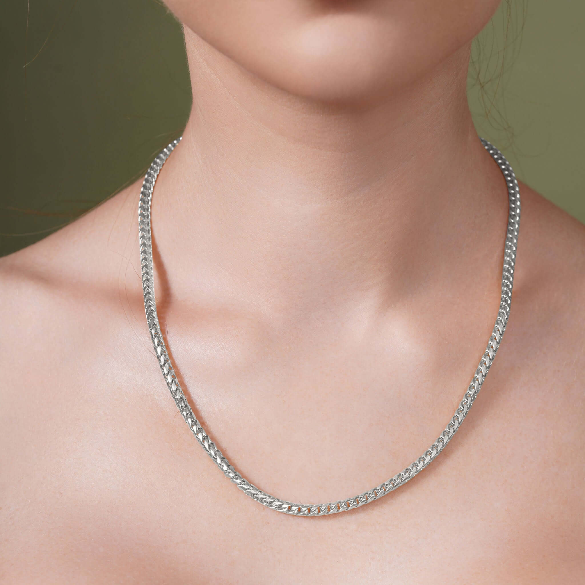 Diamond Cut Franco Chain displayed on a model's neck, showcasing its shine and elegant design.