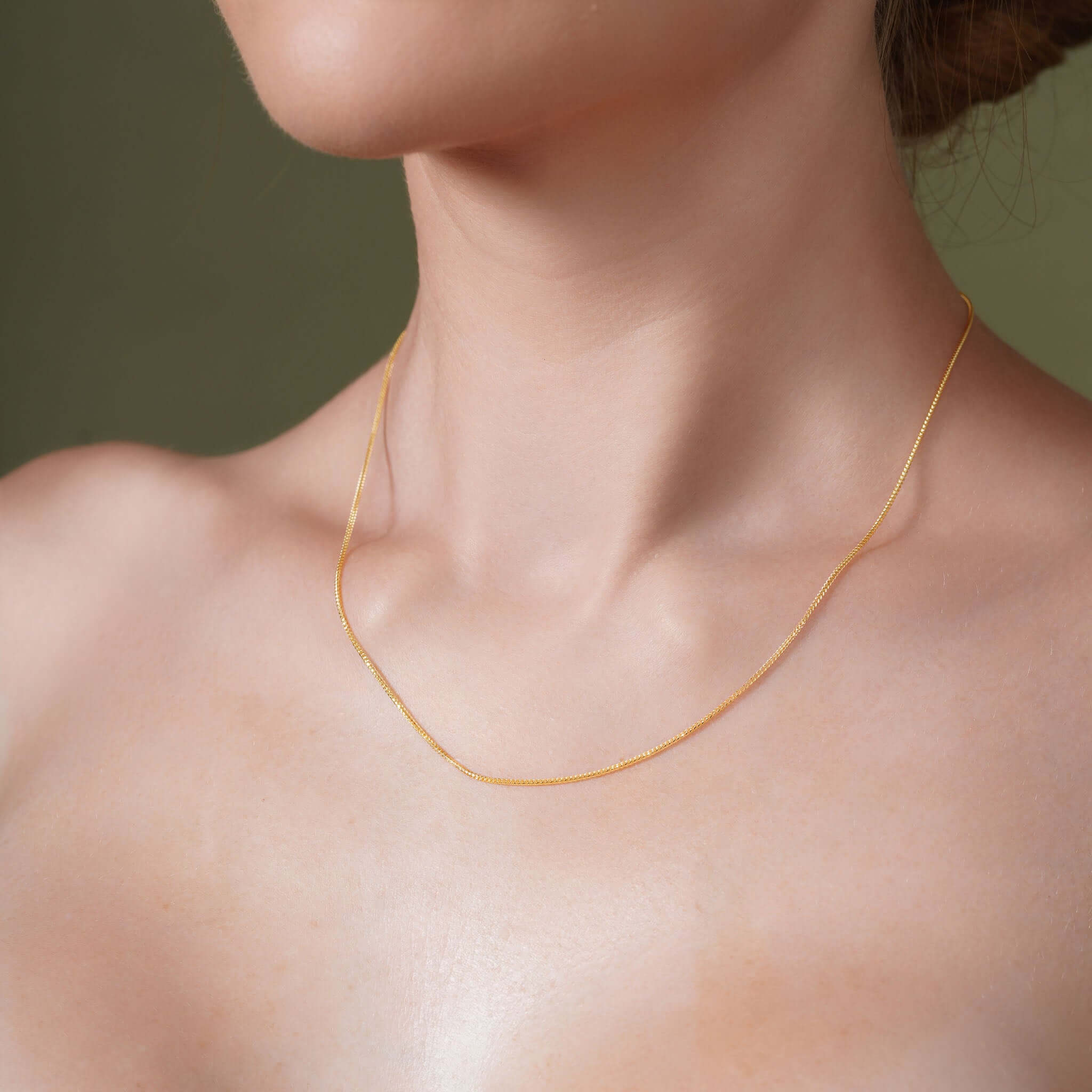 Diamond Cut Franco Chain worn by a model, showcasing its sparkling diamond-cut facets and elegant design.