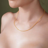 Diamond Cut Franco Chain worn by a model showcasing its shimmering 14k gold design.