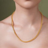 Diamond Cut Franco Chain in solid gold, elegantly worn around the neck, showcasing its sparkling facets.