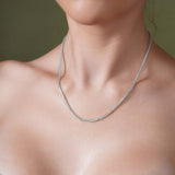 Franco Gold Chain displayed on a model, showcasing its sleek design in solid yellow or white gold.