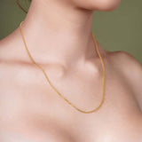 Franco Gold Chain showcased on model's neck, featuring sleek interlocking links in 14k solid gold.