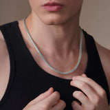 Men's Franco Gold Chain worn by a model, showcasing its sleek design and strong V-shaped links in 14k gold.