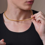 Men's Franco Gold Chain worn by a model, showcasing its sleek design and interlocking links.