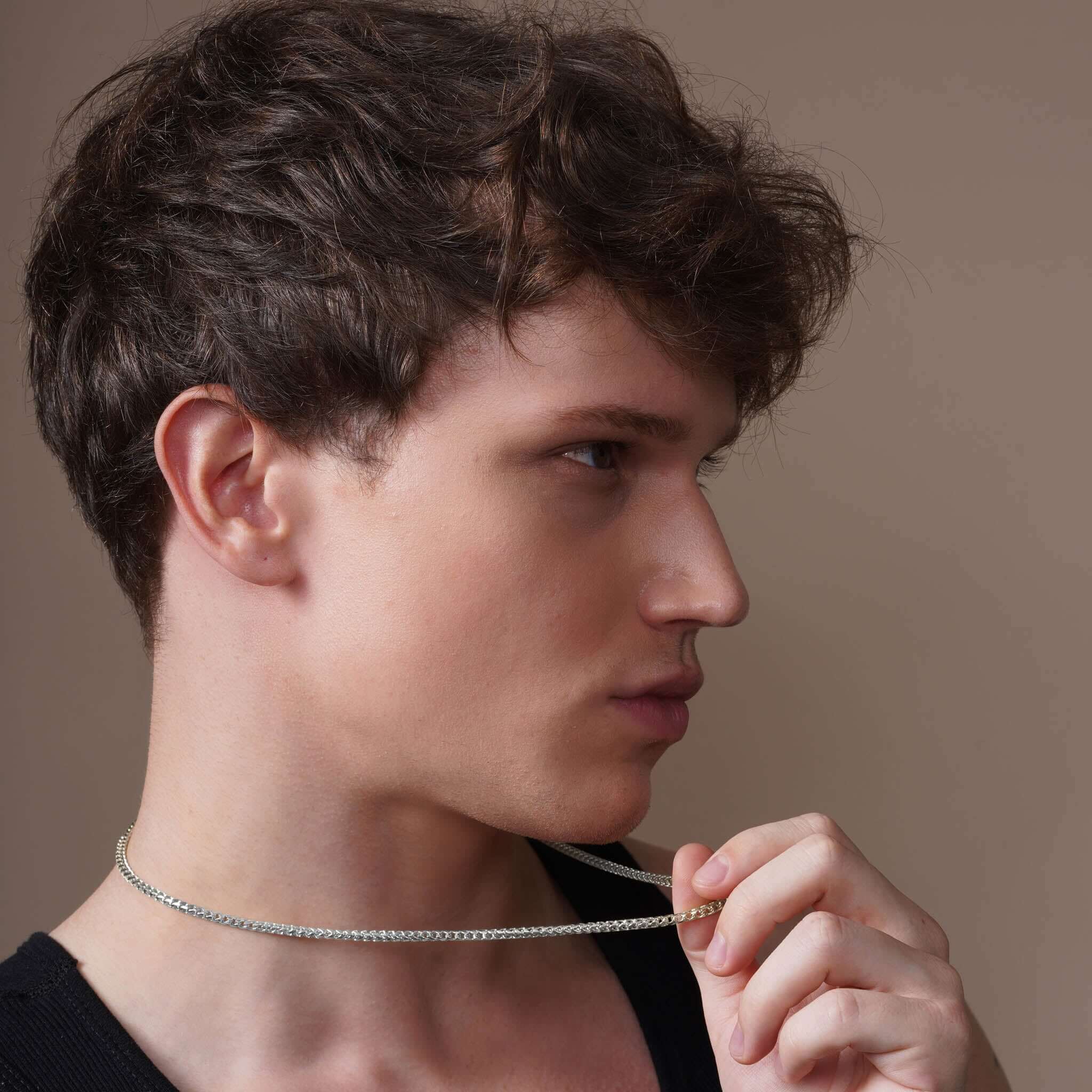 Men's Diamond Cut Franco Gold Chain worn by model showcasing its style and brilliance.