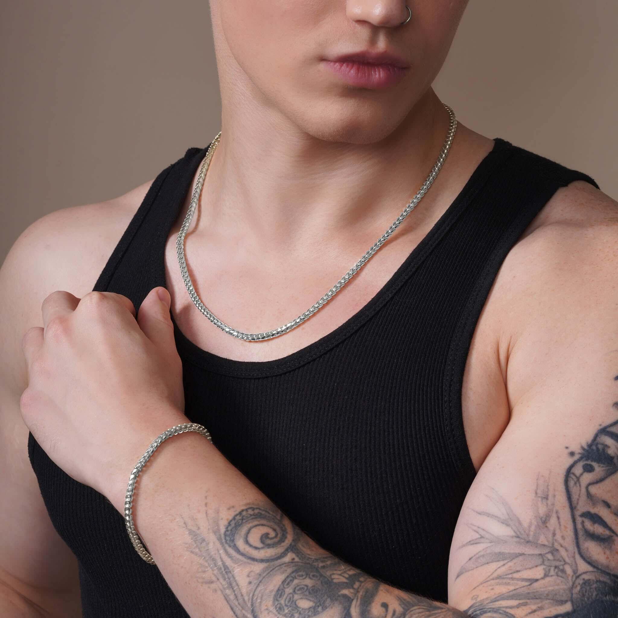 Men's Diamond Cut Franco Gold Chain worn by a man featuring diamond-cut design and stylish elegance.