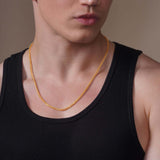 Men's Diamond Cut Franco Gold Chain worn by a model with a sleek style and modern elegance.