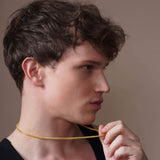 Men's Diamond Cut Franco Gold Chain worn by a young man, showing its sleek and sophisticated design.