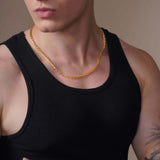 Men's Open Franco Gold Chain worn by a man in a black tank top, showcasing its polished design.