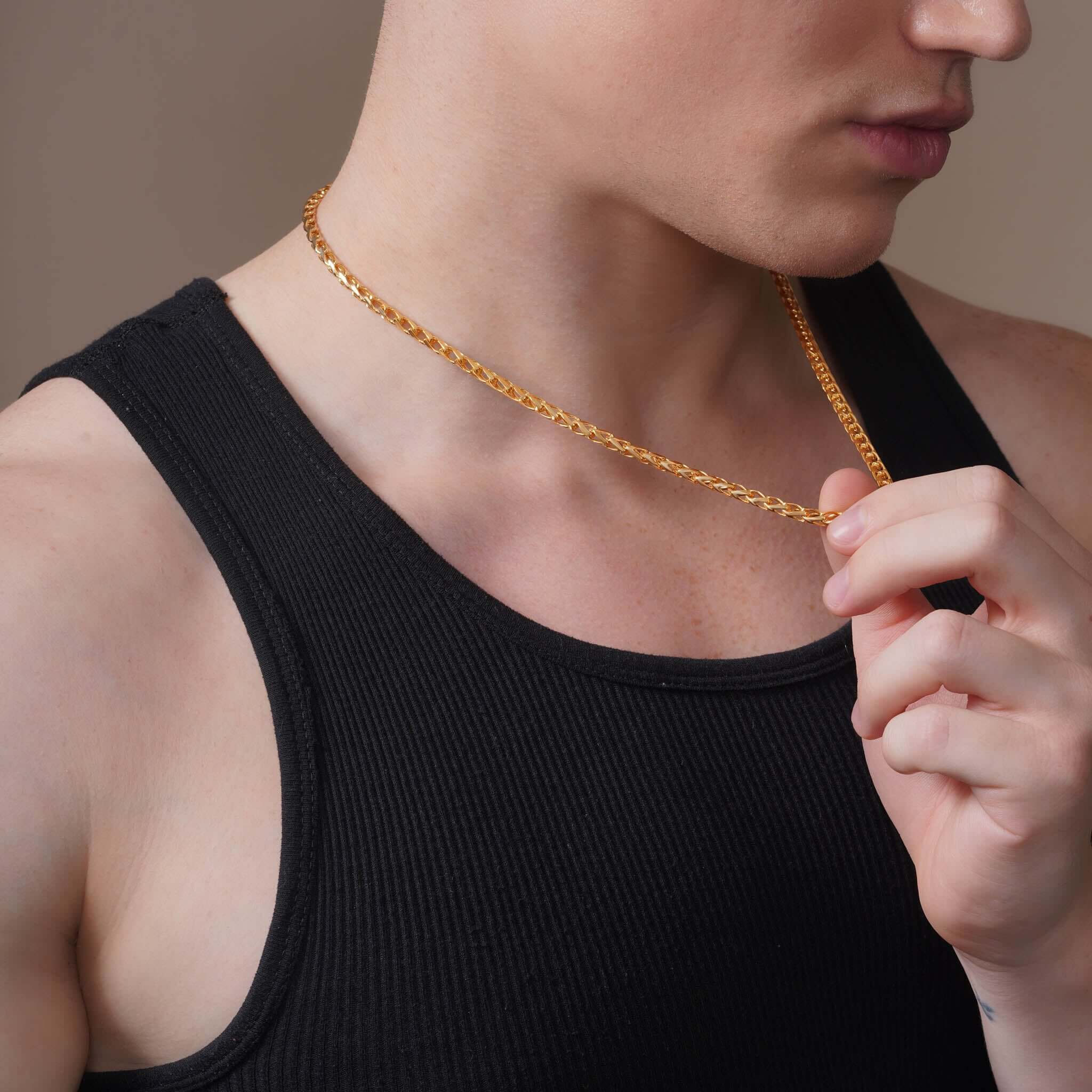 Men's Open Franco Gold Chain worn by a man in a sleeveless shirt, showcasing its elegance and craftsmanship.