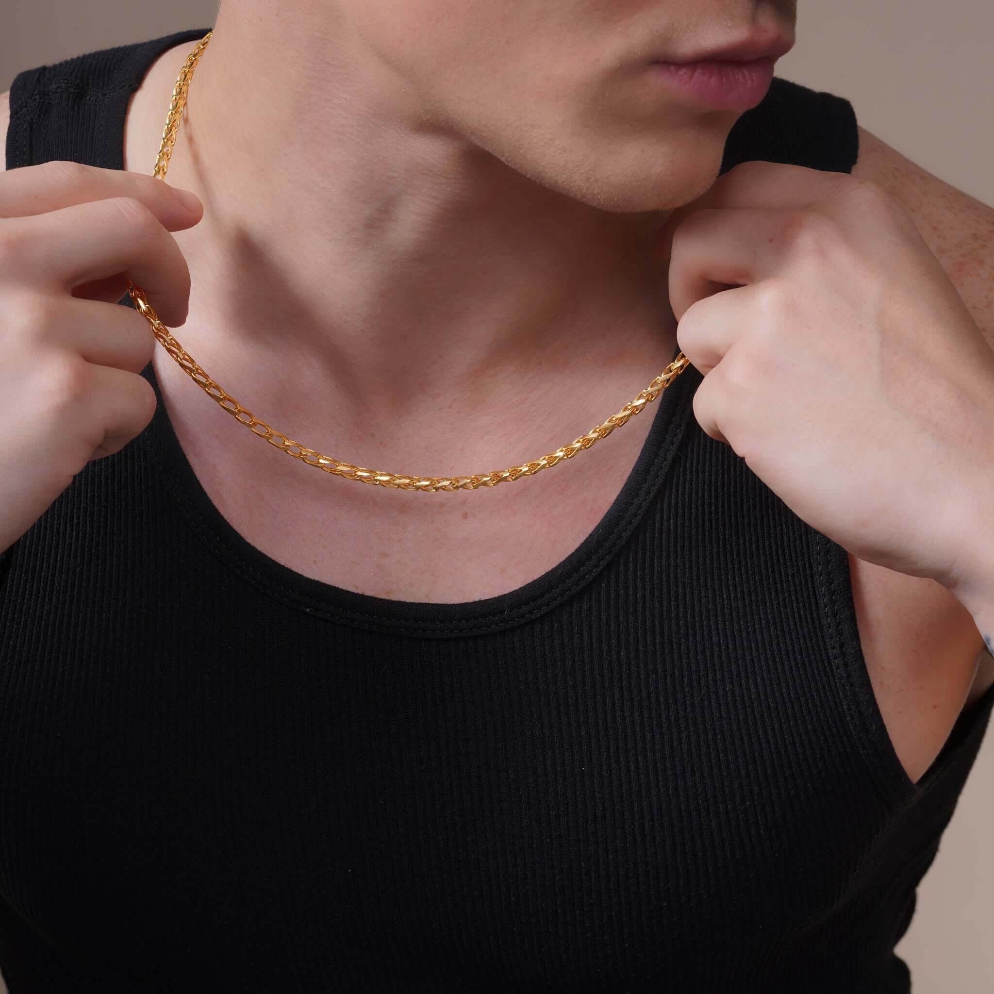 Men's Open Franco Gold Chain worn by model, showcasing elegance and durability in 14k yellow gold.