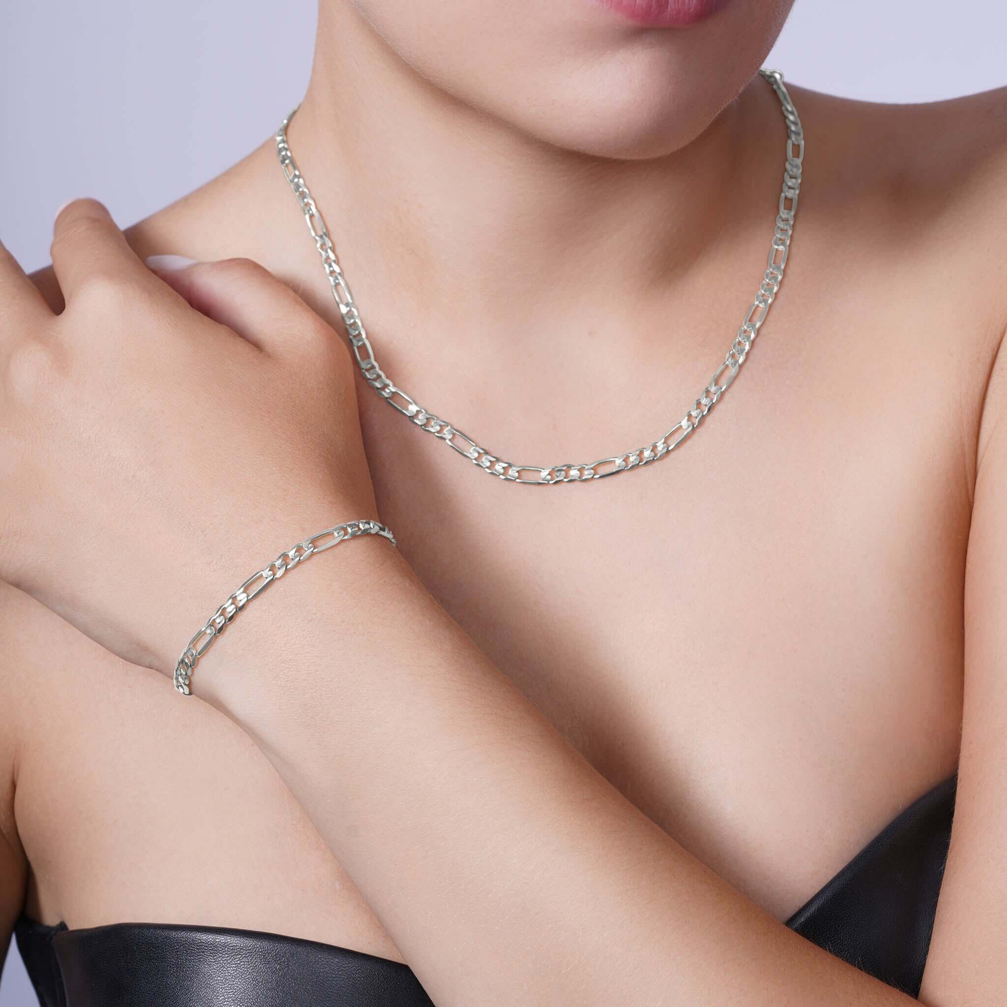 Figaro Gold Chain worn as a necklace and bracelet, showcasing elegance in 14k white gold.