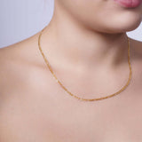 Figaro Gold Chain displayed elegantly on a woman's neck, showcasing its timeless design and quality craftsmanship.