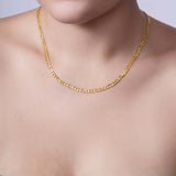 Figaro Gold Chain worn by a model, showcasing its elegant design in yellow gold.