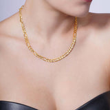 Figaro Gold Chain worn by a model, showcasing its elegant design in 14k yellow gold.