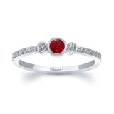 Mia Ruby Three Stone Diamond Promise Ring featuring a central ruby and sparkling diamonds on both sides.