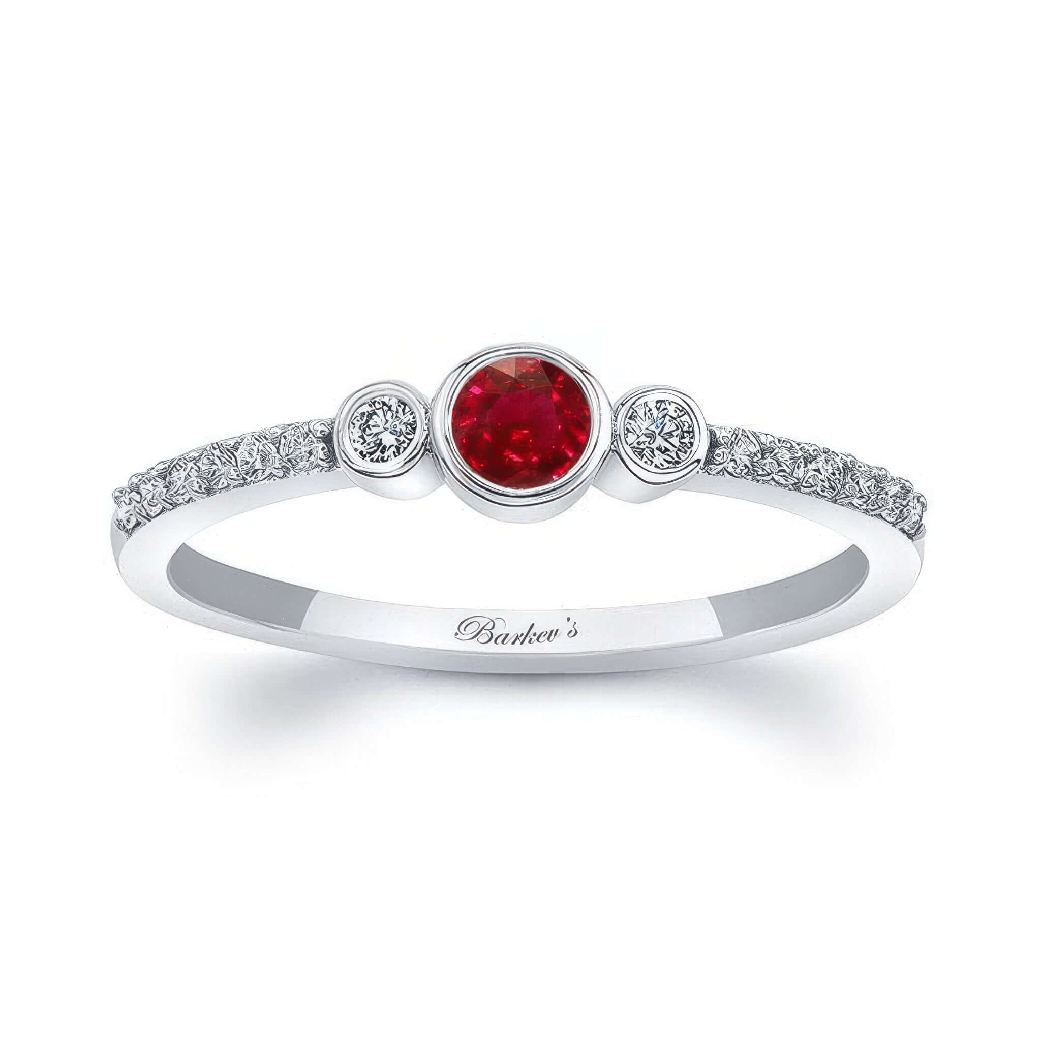 Mia Ruby Three Stone Diamond Promise Ring featuring a central ruby and sparkling diamonds on both sides.