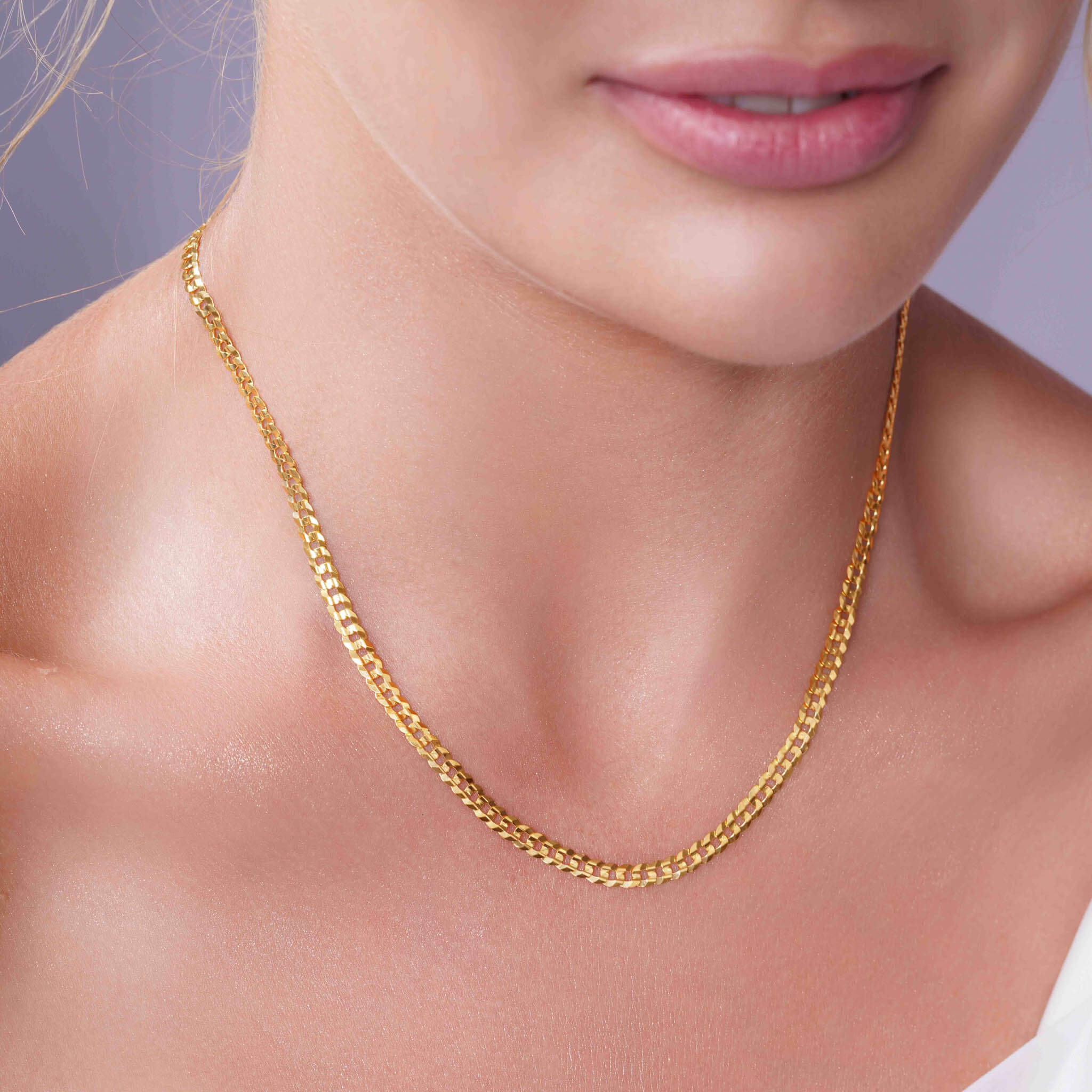 Vermeil Curb Chain worn elegantly, showcasing its gold luster and classic curb link design.