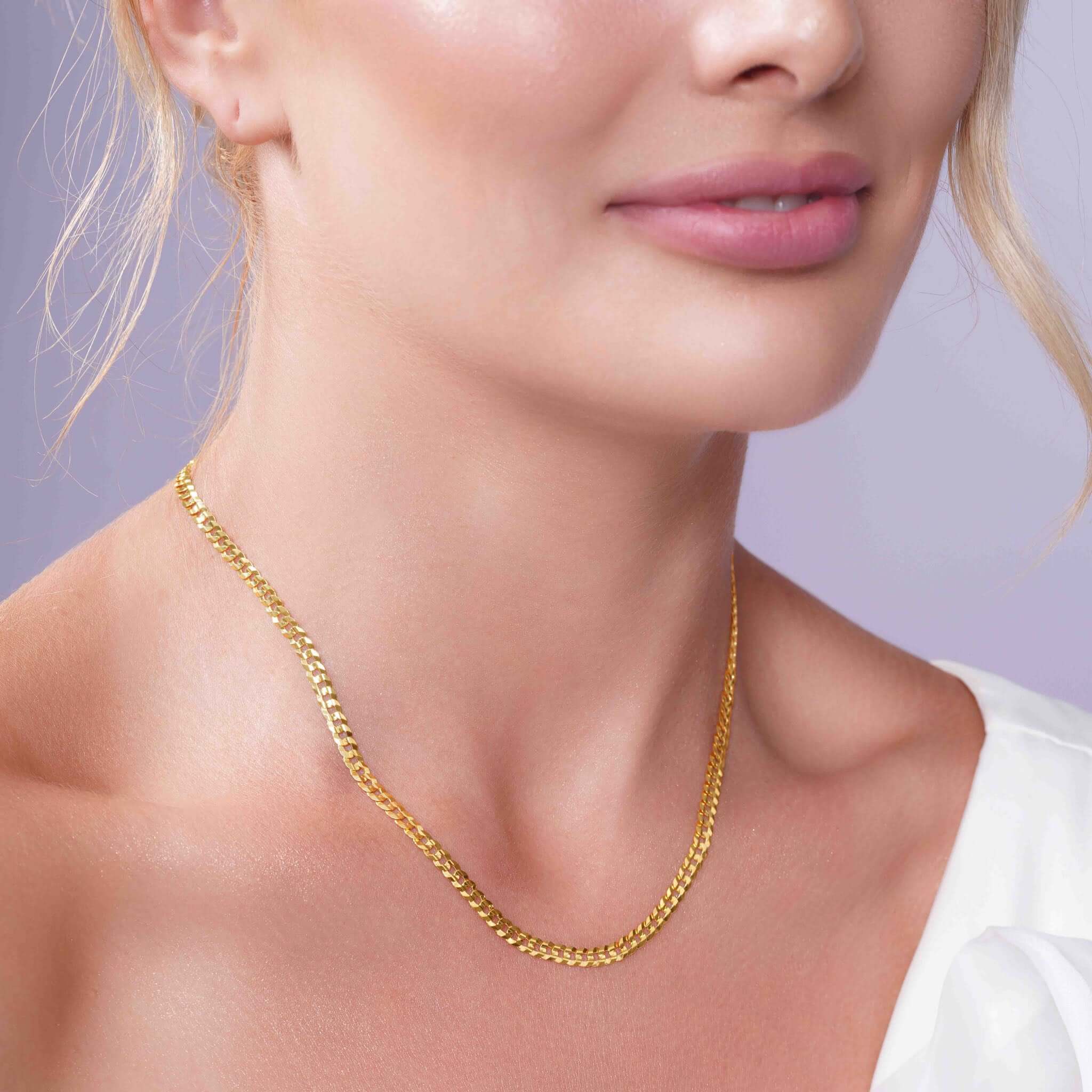 Vermeil Curb Chain styled on model, showcasing its 18k vermeil gold plating and classic curb link design.