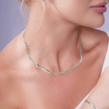 Curb Silver Chain elegantly worn by a model, showcasing its timeless design and refined elegance.