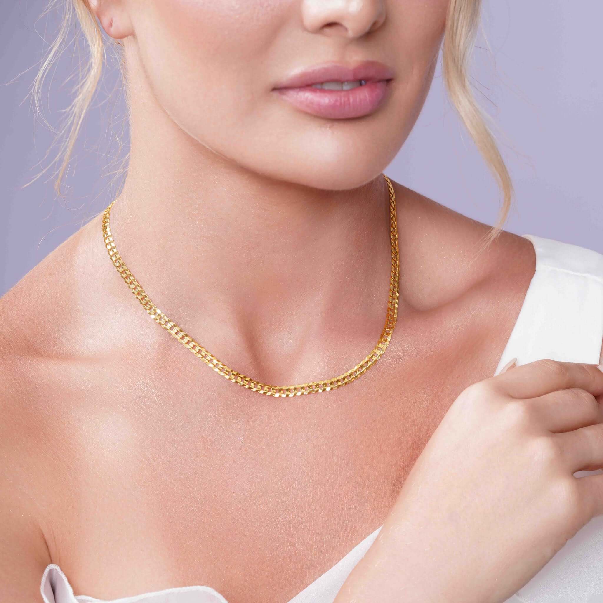 Vermeil Curb Chain worn elegantly by a model, showcasing its luxurious design and sleek curb link style.