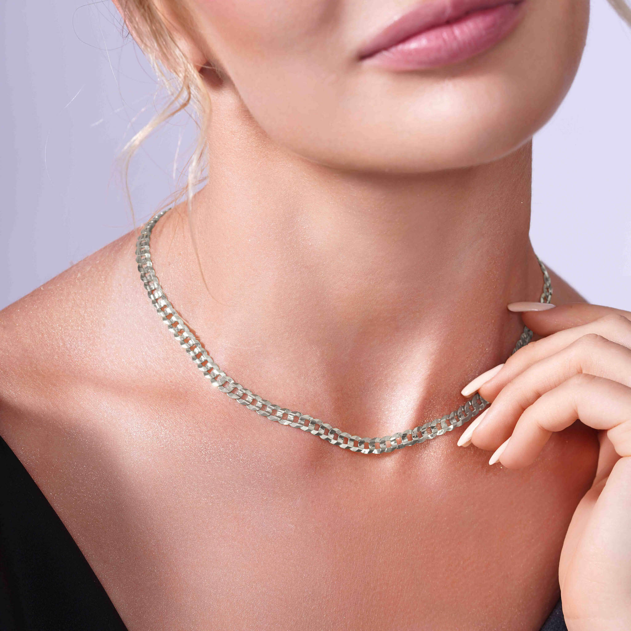 Curb Silver Chain elegantly displayed on a model's neck, showcasing its refined design and sophisticated appeal.