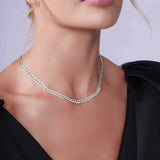 Curb Silver Chain displayed on a model, showcasing its elegant design and refined craftsmanship.