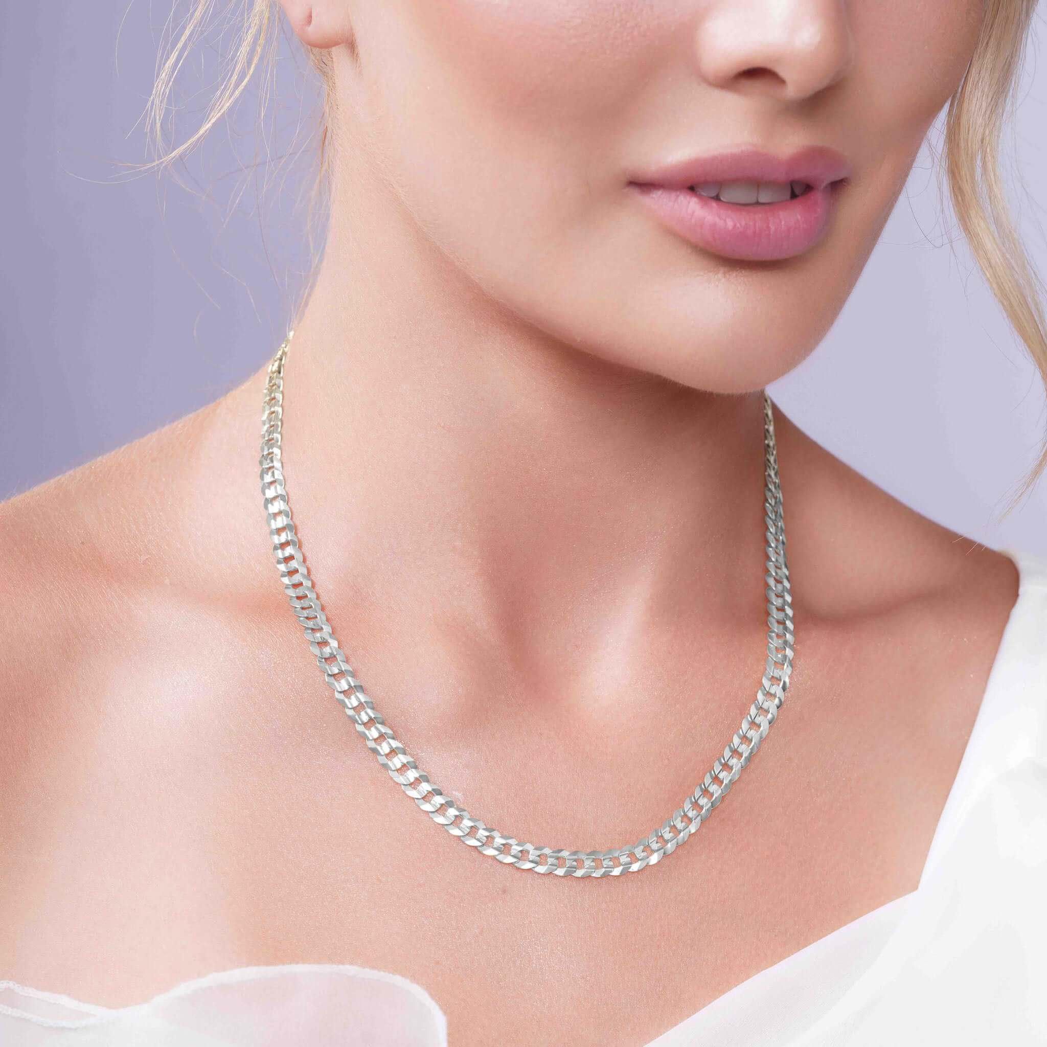 Curb Silver Chain worn elegantly by a model, showcasing its timeless design and refined elegance.