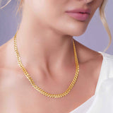 Vermeil Curb Chain worn by a model, showcasing its 18k gold plating and classic curb link design.