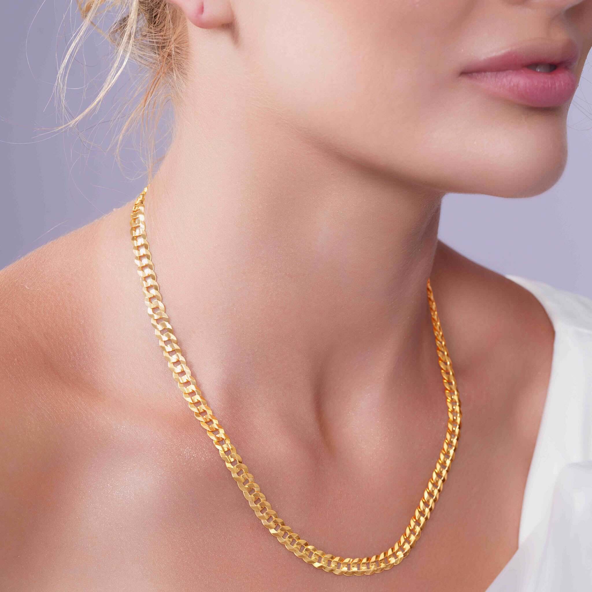 Vermeil Curb Chain worn elegantly, showcasing 18k vermeil gold plating and a classic curb link design.