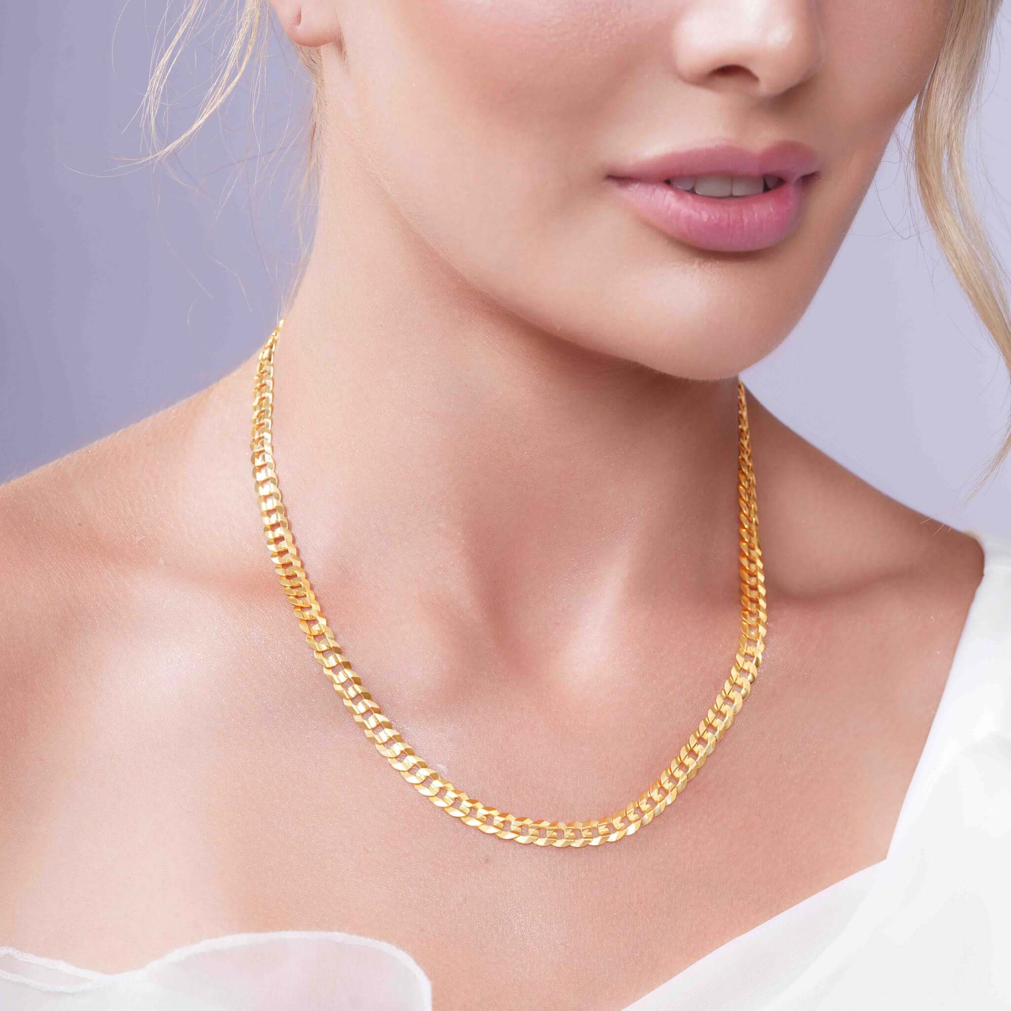 Vermeil Curb Chain worn elegantly by a model, showcasing its 18k gold plating and classic curb link design.