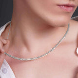 Men's Curb Silver Chain elegantly displayed on a model's neck, showcasing its sleek and polished design.
