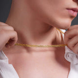 Men's Vermeil Curb Chain draped around a man's neck, showcasing its elegant design and 18k gold vermeil finish.