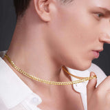 Close-up of a man wearing a Men's Vermeil Curb Chain, showcasing its luxe 18k gold vermeil finish and classic design.