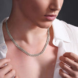 Men's Curb Silver Chain displayed on a male model, showcasing its sleek and polished design against a light shirt.