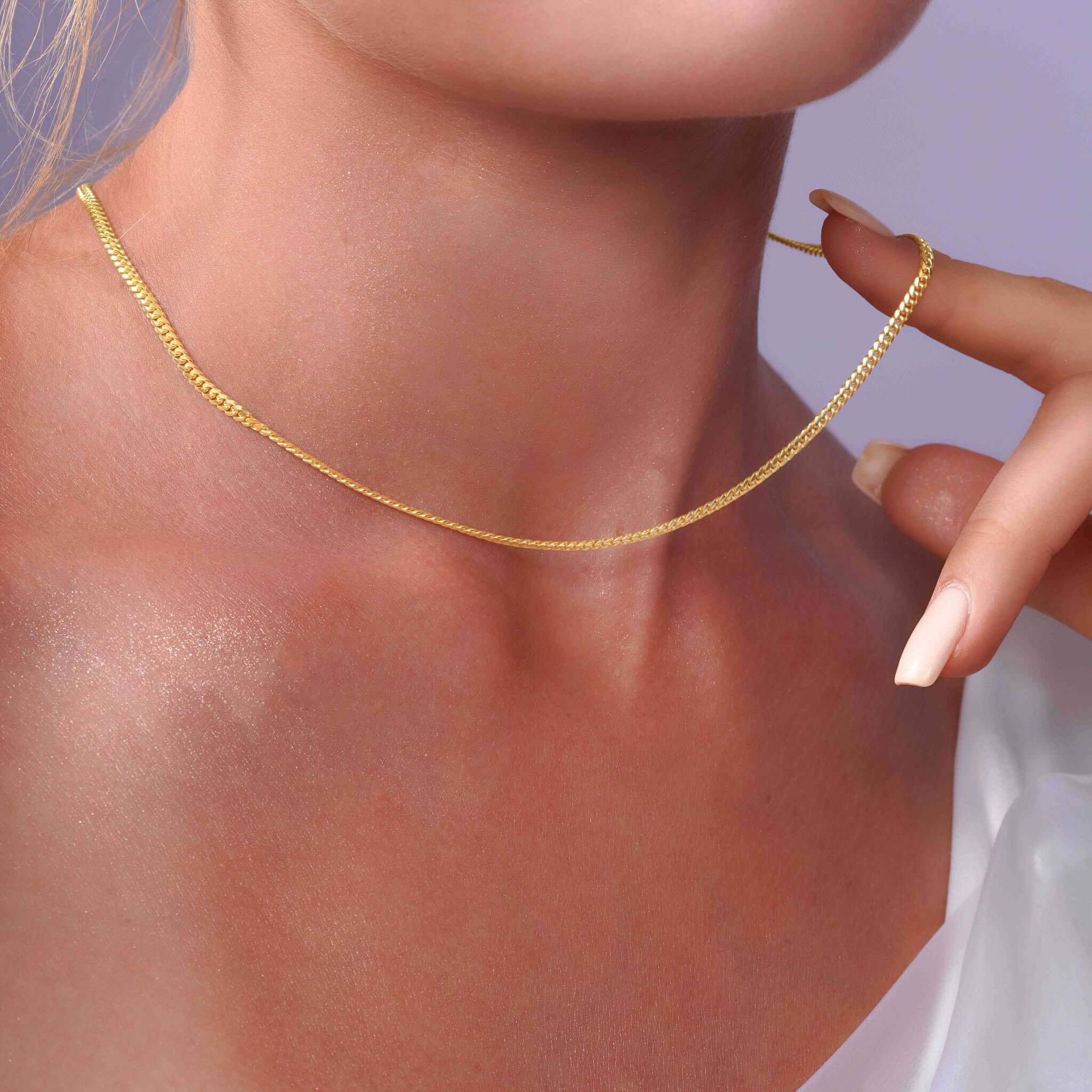 Vermeil Miami Cuban Chain elegantly highlighted on a model's neck, showcasing its lustrous vermeil finish.