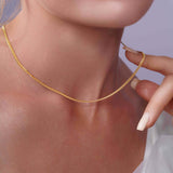 Vermeil Miami Cuban Chain worn elegantly by a model, showcasing its lustrous, interlocking design.