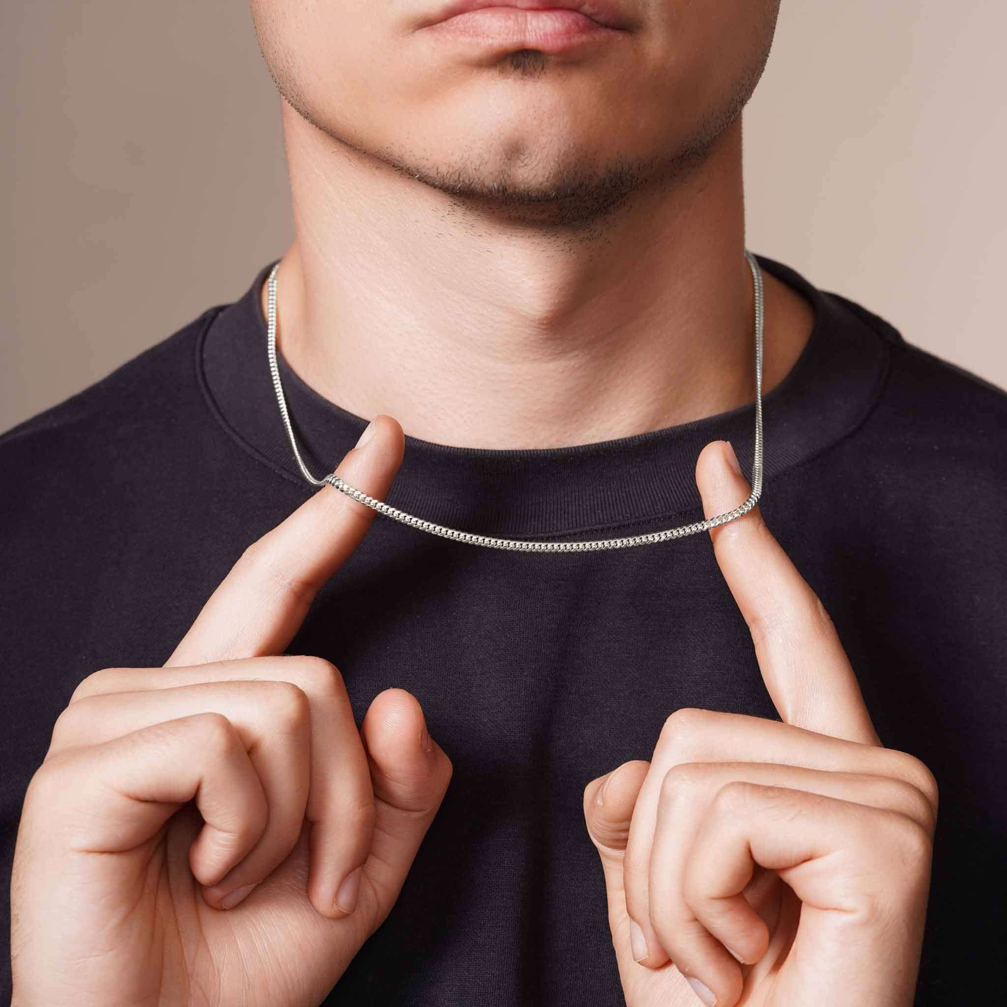 Men's Silver Miami Cuban Chain worn by model, showcasing its sleek design and polished finish.